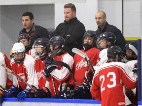 Lasalle, Ontario. August 21, 2019 --  Leamington Flyers coach Cam Crowder, top centre, and the Flyers had their hands full in first exhibition game against LaSalle Vipers at Vollmer Centre Wednesday.