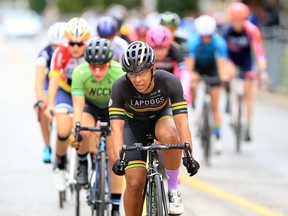 Kathleen MacEwan, front, leads a group of Masters and U17 cyclists during Tour di Via Italia International Bicycle Races on Erie Street East Sunday.