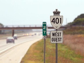 A road sign along west bound Highway 401, just east of Manning Road.