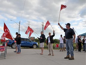Nemak workers picket outside the gates to the plant in west Windsor on Wednesday, Sept. 4, 2019.