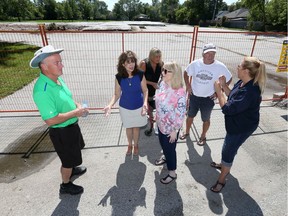 Tecumseh home owners Tony Teno, left, Lucy Pereira, Lori McConnell, Debbie Dancy, Ron McConnell and Denise St. Louis, right, are concerned over the height, density and overall curb appeal of a proposed housing development on Dillon Drive.