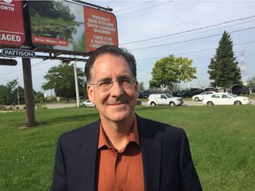 MP Brian Masse is photographed in front of one of his billboards during a press conference in Windsor on Tuesday, September 10, 2019.