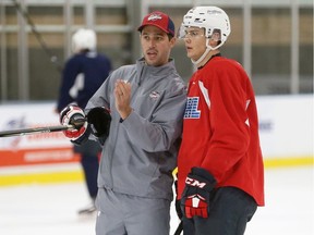 Windsor Spitfires' associate head coach Jerrod Smith, at left, is interested in the club's vacant head coaching post.