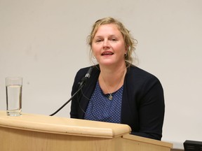 Panelist Jackie Hansen, Amnesty International Canada's gender rights campaigner,  takes to the podium at University of Windsor Faculty of Law for an event hosted by law professor Reem Bahdi (not shown), Transnational Law and Justice Nework.