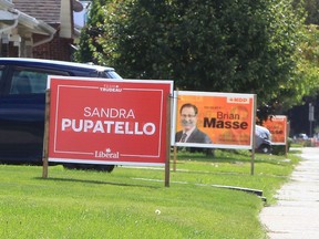 Signs on Parent Avenue lawns in the Windsor West riding.
