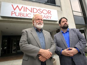 David Armour, left, president of the United Church of Canada, brought support in the form of a $50,000 donation from The United Church of Canada Foundation's Bulding Hope for Homeless campaign Monday.  In photo, Armour visits with Downtown Mission Exec. Director Ron Dunn outside the Main Library on Ouellette Avenue Monday, which will be converted into transitional housing suites once the Downtown Mission takes possession.