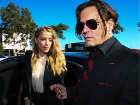 In this April 17, 2016, file photo, actor Johnny Depp and his then-wife Amber Heard arrive at a court in the Gold Coast. Johnny Depp's wife had filed for divorce, citing irreconcilable differences after 15 months of marriage to the Hollywood "Pirates of the Caribbean" star.
