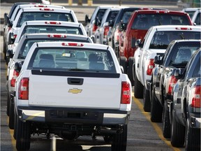 New GM Chevrolet trucks sit on the lot awaiting transport to dealers at the General Motors Pontiac Truck Assembly Plant October 17, 2008 Pontiac, Michigan.