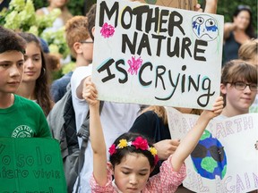 Climate activist protest near the UN headquarters on Aug. 30, 2019, in New York. Swedish climate change campaigner Greta Thunberg joined hundreds of other teenagers protesting outside the United Nations in her first demonstration on US soil since arriving by zero-carbon yacht. Thunberg, 16, has spurred teenagers and students around the world to gather every Friday under the rallying cry "Fridays for future" to call on adults to act now to save the planet.