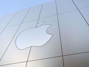 (FILES) In this file photo taken on September 22, 2017 an Apple logo is seen on the outside of an Apple store as new iPhones are released for sale in San Francisco, California.