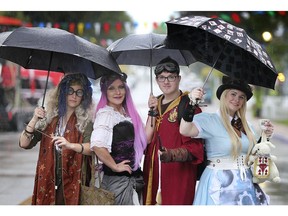 It was a soggy start for the Amherstburg Uncommon Festival on Friday, September, 27, 2019 as heavy rain fell most of Friday night. Sylvia Ward, left, Stephanie Leipold, Brandon Oram and Kathleen Semenuk didn't let the rain dampened their spirits as they pose for a photo on Dalhousie Street in downtown Amherstburg.