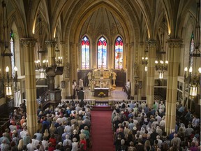 Parishioners return to mass at the historic Assumption Catholic Church, Sunday, Sept. 8,  2019. This is the first mass since 2014 when critical restoration needs closed the church.