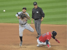 Detroit Tigers second baseman Harold Castro (30) turns a double play by forcing out Cleveland Indians first baseman Jake Bauers (10) and throwing to first base in the seventh inning at Progressive Field.