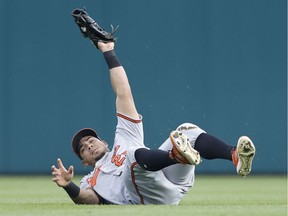 Baltimore Orioles left fielder Anthony Santander (25) makes a diving catch against the Detroit Tigers during the fourth inning at Comerica Park.