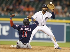 Detroit Tigers short stop Willi Castro gets a force out at second base as Minnesota Twins short stop Jorge Polanco slides into second base during the 9th inning at Comerica Park.