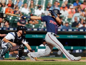 Minnesota Twins first baseman LaMonte Wade Jr. (30) hits an RBI single in the seventh inning added at Comerica Park.