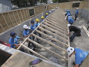 Students with the Windsor-Essex Catholic District School Board's construction academy were helping build a home for the Habitat For Humanity organization on Tuesday, September 24, 2019, in Kingsville. The students are shown lifting an interior wall into place at the home on Maple Street.