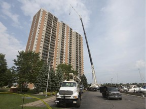 A large crane is used for roof repair at Solidarity Tower, Friday, September 13, 2019.
