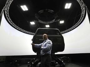 Tony Mancina, head of engineering, FCA Canada is shown next to an advanced driving simulator on Tuesday, September 24, 2019, at the FCA Automotive Research & Development Centre in Windsor.