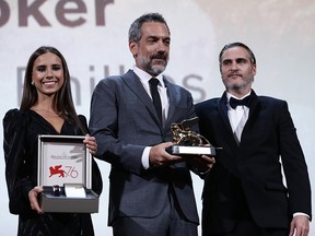 Todd Phillips and Joaquin Phoenix receive the Golden Lion for Best Film Award for ‘Joker’ and a Jaeger-LeCoultre Unique engraved Reverso watch during the Award Ceremony during the 76th Venice Film Festival at Sala Grande on Sept. 7, 2019 in Venice, Italy.