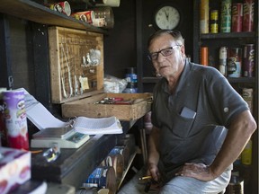 Claude Bradley, master bander with the Holiday Beach Migration Observatory, sits at a banding station inside a blind at the Holiday Beach Conservation Area, Thursday, September 19, 2019, as volunteers wait to trap hawks.