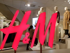 FILE PHOTO: The logo of H&M is seen in a display window of a store in Zurich, Switzerland January 7, 2019.