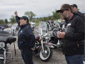 Becky Mills, left, executive director of the Windsor-Essex Therapeutic Riding Association, says a few words with Kevin Telfer, event coordinator with the Iron Horse Motorcycle Club, before hitting the road for the 9th annual Hogs for Horses Ride, Sunday,  September 29, 2019.  The fundraiser is put on by the Windsor-Essex Therapeutic Riding Association and the Iron Horse Motorcycle Club.