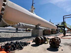 In this June 8, 2017, file photo, fresh nuts, bolts and fittings are ready to be added to the east leg of the pipeline near St. Ignace, Mich., as Enbridge Inc., prepares to test the east and west sides of the Line 5 pipeline under the Straits of Mackinac in Mackinaw City, Mich.
