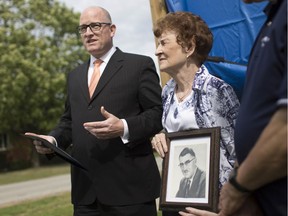 Mayor Drew Dilkens speaks about the history of former Essex County Warden Robert McDonald next to McDonald's daughter, Donna Robinson, on Friday, when a new sign was unveiled for Robert McDonald Park.