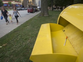 A used needle is shown Sept. 3, 2019, sitting in the top of one of the city's sharps drop-off bins, this one located at Senator David A. Croll Park near Windsor city hall.