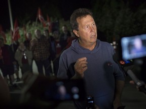 WINDSOR, ONT:. SEPTEMBER 14 - Unifor national representative, Chris Taylor, addresses the media at the picket line late Saturday evening, September 14, 2019, with the decision they will continue with the blockade.