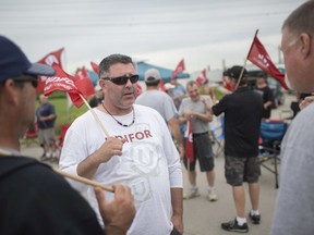 Workers at Nemak picket outside the gates to the plant in west Windsor on Tuesday, Sept. 3, 2019.