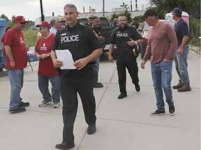 Windsor Police Service officers leave the blockade in front of the Nemak plant in west Windsor on Friday, Sept. 6, 2019. Union leadership were served court papers ordering them to end the blockade.