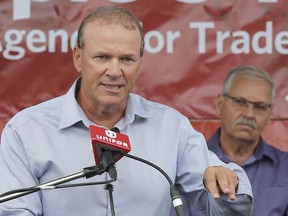 Unifor Local 200 President John D'Agnolo, left, speaks as OPSEU President Smokey Thomas looks on during a union rally on Thursday, Sept. 12, 2019, at the Nemak plant in Windsor.