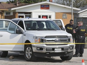 McGREGOR, ON. SEPTEMBER 10, 2019. --  OPP officers are shown near a truck that was the subject of an investigation on Tuesday, September 10, 2019, in McGregor, ON.