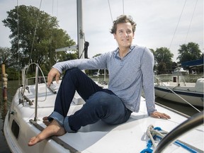 Tim Cooke, 21, sits on his boat at the South Port Sailing Club, Friday, September 13, 2019. Cooke sailed across the Atlantic Ocean this past summer.