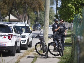 Windsor police stand outside a home on Assumption St. after a reported stabbing at the intersection of Marentette Ave. and Brant St., one block north of Wyandotte St. East where Open Streets was being held, Sunday, September 22, 2019.