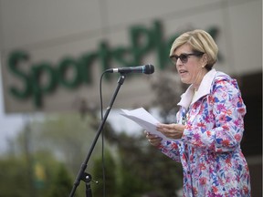 Claudia den Boer, CEO, Canadian Mental Health Association Windsor-Essex County Branch, speaks at the start of the 4th annual Suicide Prevention Awareness Walk that was held at the St. Clair College main campus Sunday morning,  September 29, 2019.