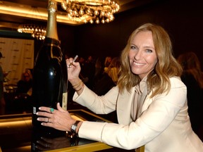 Toni Collette signing special bottle of Moët & Chandon. (Tom Sandler)