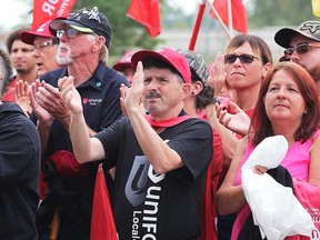 Union members applaud a speech by Unifor national president Jerry Dias outside the Nemak plant, the site of a 13-day blockade, after Nemak announced it would close operations in Windsor in 2020.