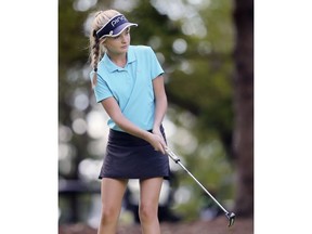 Kyla Charlebois eyes a putt during Monday's WECSSAA golf championship at Kingsville. Charlebois won the girls' individual title and helped Villanova defend its team title.