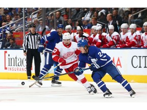 Red Wings winger Taro Hirose chases down Maple Leafs counterpart Kasperi Kapanen during an NHL pre-season game at Scotiabank Arena on Sept. 28 in Toronto.