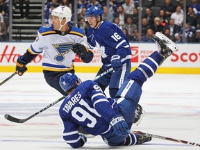 John Tavares #91 and Mitchell Marner #16 of the Toronto Maple Leafs collide during action against the St. Louis Blues in an NHL game at Scotiabank Arena on Oct. 7, 2019, in Toronto. The Blues defeated the Leafs 3-2.