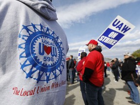 United Auto Workers union members and their families rally near the General Motors Flint Assembly plant on Solidarity Sunday on October 13, 2019 in Flint, Michigan. UAW and GM have reached a tentative agreement that could end the weeks long strike.