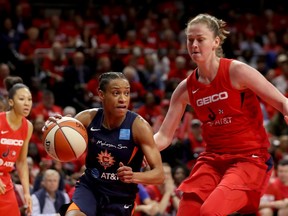 Jasmine Thomas #5 of Connecticut Sun drives around Emma Meesseman #33 of Washington Mystics in the first half during Game Five of the 2019 WNBA Finals at St Elizabeths East Entertainment and Sports Arena on Oct. 10, 2019, in Washington, DC.