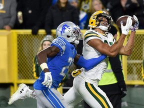 Allen Lazard #13 of the Green Bay Packers catches a touchdown in the fourth quarter Justin Coleman #27 of the Detroit Lions at Lambeau Field on October 14, 2019 in Green Bay, Wisconsin.