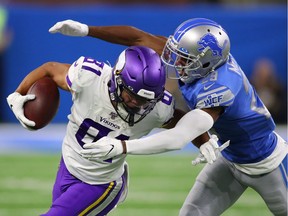 Bisi Johnson of the Minnesota Vikings tries to get around the tackle of Rashaan Melvin of the Detroit Lions during the first half at Ford Field on October 20, 2019 in Detroit, Michigan.
