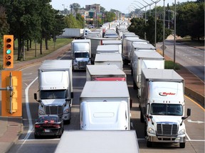 Hundreds of transport trucks cover all three lanes on northbound Huron Church Road at Girardot Street in this file photo from Aug. 13.