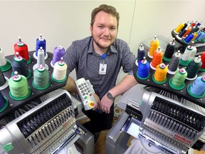 Phoenix Thomas, 29, works in the embroidery department at Downtown Mission's Chari-Tees.  Thomas is a graduate of the Mission's social enterprise program and has made improvements to the embroidery process since he was hired.