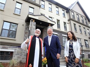Canterbury College president Bruck Easton, centre, and general manager Shelley Bolger greet Bishop Robert Bennett, left, at the official opening and ribbon cutting of Canterbury Commons, the new, 62 room residence at 210 Patricia St. Thursday evening.  The residence features five, two-storey houses within the structure.  University of Windsor graduate students and senior undergrads will be eligible to live in the structure.